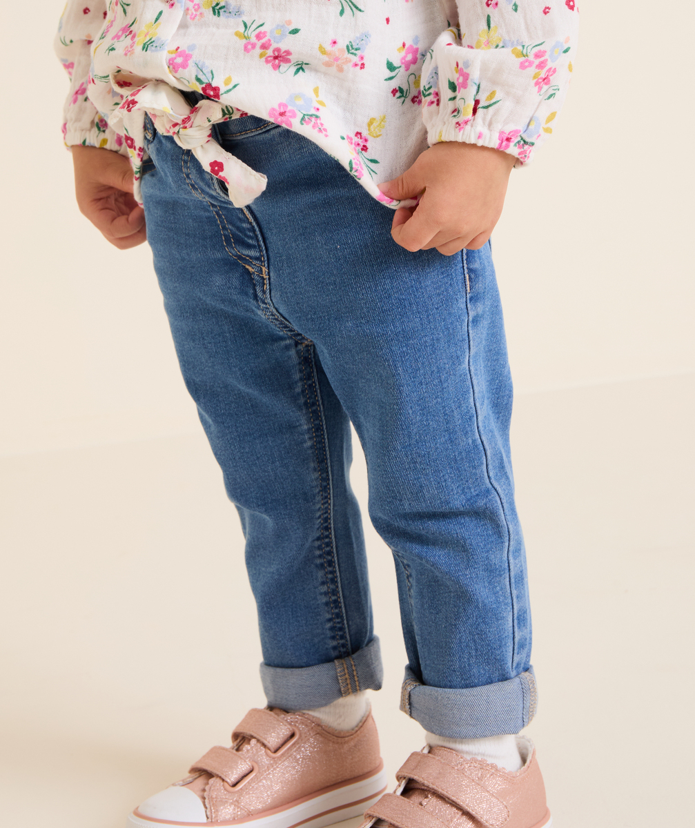 Baby girl blue jeans with floral belt