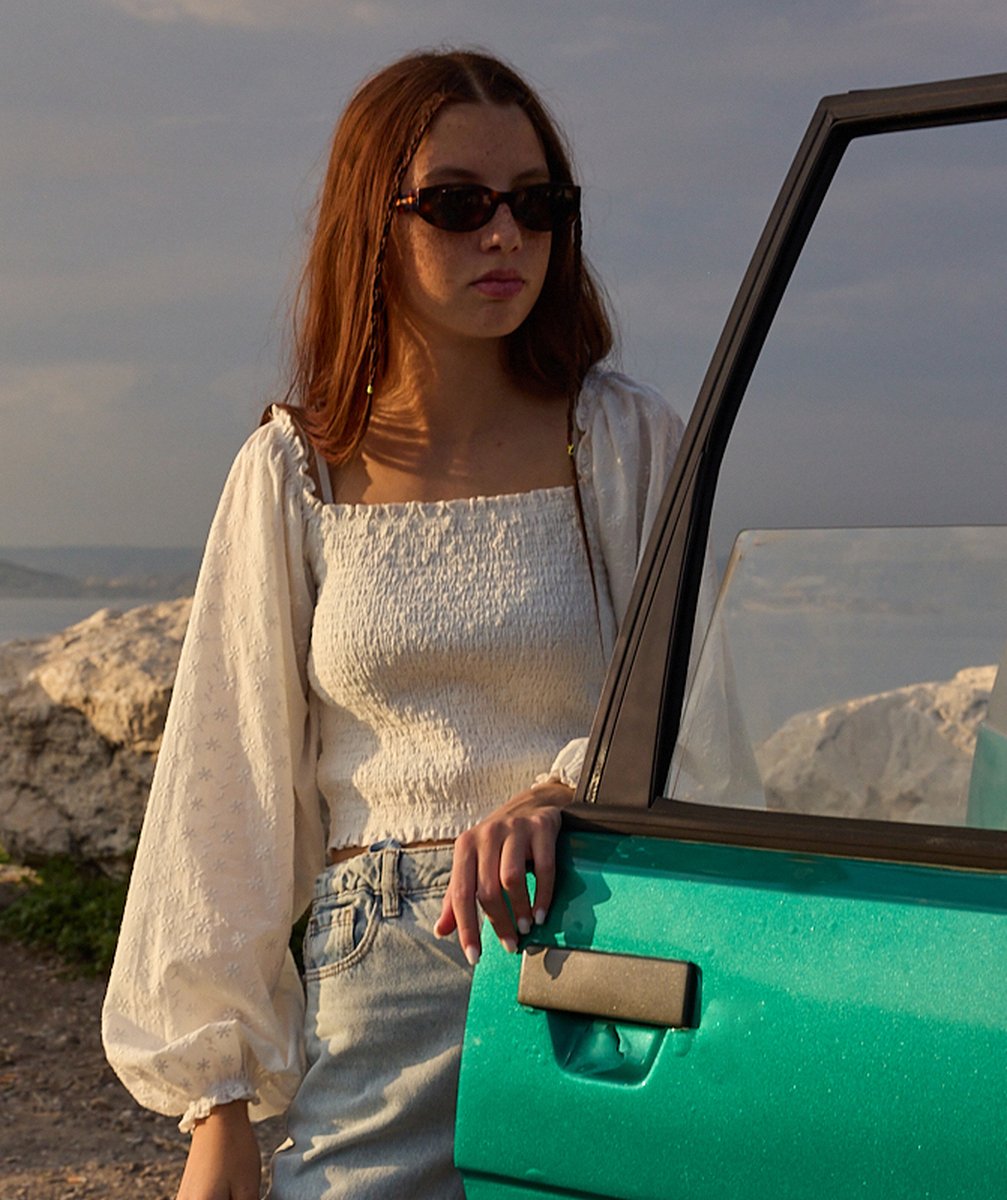 Girl's white puff-sleeve shirt